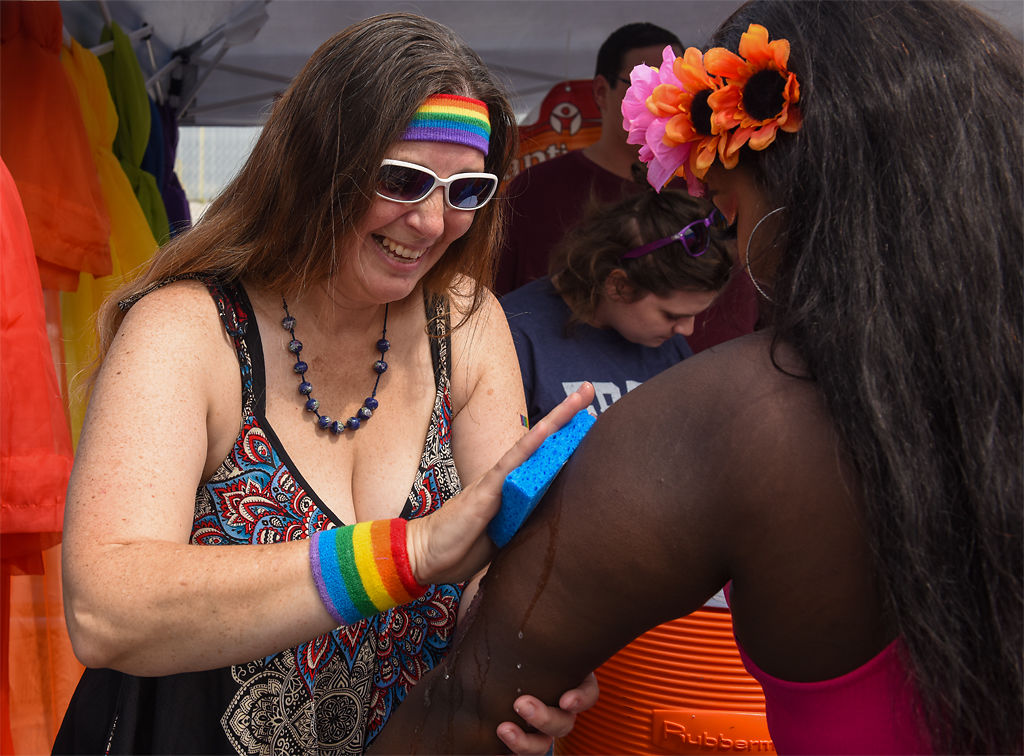 Rebekah Robertson puts temporary tattoos on attendees at the Mid-Missouri PrideFest